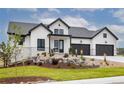 Modern farmhouse exterior with stone accents and landscaping at 5300 Soledad Cir, Parker, CO 80134