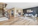 Spacious living room featuring hardwood floors and a fireplace at 297 Portmeirion Ln, Castle Rock, CO 80104