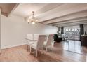 Dining area with glass table and four chairs at 8060 E Girard Ave # 208, Denver, CO 80231