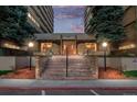 Apartment building entrance with brick stairs and landscaping at 8060 E Girard Ave # 208, Denver, CO 80231