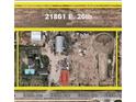 Aerial view of a property with various structures, including a large building and a round structure at 21861 E 26Th Ave, Aurora, CO 80019