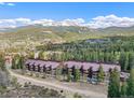 Aerial showing condos, mountain, and town views at 840 Four O Clock Rd # A2E, Breckenridge, CO 80424