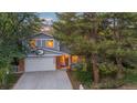 Two-story home with a gray exterior, attached garage, and basketball hoop at 9641 Sierra Dr, Arvada, CO 80005