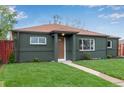 Newly renovated ranch home with a modern exterior and nicely landscaped lawn at 9400 Lilly Ct, Thornton, CO 80229