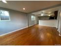 Bright and airy living room with hardwood floors and open concept at 1522 Tamarac St, Denver, CO 80220