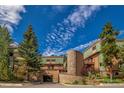 Front view of a charming multi-unit building nestled in a mountain setting at 465 Four Oclock Rd # 323, Breckenridge, CO 80424