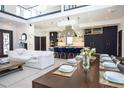 Modern kitchen with navy cabinets, a large island, and high-end appliances at 4960 S Lipan Dr, Englewood, CO 80110