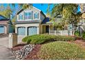 Two-story house with a two-car garage and landscaping at 63 Moss Way, Golden, CO 80401