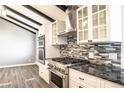 Modern kitchen with stainless steel appliances and granite countertops at 3790 S Roslyn Way, Denver, CO 80237