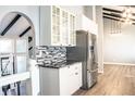 Modern kitchen with stainless steel appliances and granite countertops at 3790 S Roslyn Way, Denver, CO 80237
