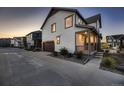 Two story house exterior, side view with garage at 9307 Inca Dove Cir, Littleton, CO 80125