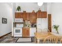 Galley kitchen with wood cabinets and white appliances at 34 Highfield Trl # 315, Breckenridge, CO 80424