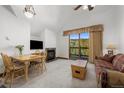 Spacious living area with fireplace and access to balcony at 34 Highfield Trl # 315, Breckenridge, CO 80424