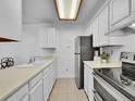 Kitchen with white cabinets and stainless steel appliances at 14751 E Tennessee Dr # 225, Aurora, CO 80012