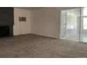 Bright living room with fireplace and carpet flooring at 2696 S Jersey St, Denver, CO 80222