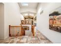 Elegant entryway with tile flooring, wooden staircase, and skylights at 2289 Old Quarry Rd, Golden, CO 80401