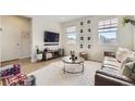 Bright and airy living room with hardwood floors and a modern aesthetic at 8041 Monte Vista Cir, Littleton, CO 80125