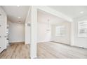 Bright dining room with hardwood floors and a chandelier at 9238 Truckee Ct, Commerce City, CO 80022