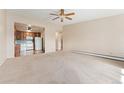 Spacious living room with open floor plan and kitchen access at 650 S Alton Way # 5D, Denver, CO 80247