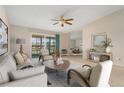 Virtually staged living room with a view to balcony at 650 S Alton Way # 5D, Denver, CO 80247