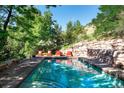 Inviting swimming pool with stone coping and comfortable seating at 3015 3Rd St, Boulder, CO 80304