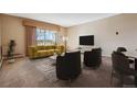 Spacious living room with large windows and patio access at 690 S Alton Way # 1C, Denver, CO 80247