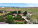 Aerial view showing house, detached garage, and surrounding landscape at 3081 W 151St Ct, Broomfield, CO 80023