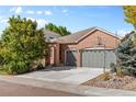 House exterior showcasing the front yard and driveway at 3942 Lazy K Dr, Castle Rock, CO 80104