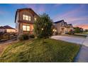 Two-story house with a welcoming front yard and landscaping at 12599 Canoe St, Firestone, CO 80504