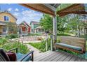 Inviting front porch with a swing, overlooking the community playground at 4720 W 37Th Ave # 29, Denver, CO 80212