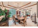 Formal dining room with ornate table and chandelier at 7454 Cameron Dr, Larkspur, CO 80118