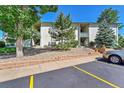 Front view of building with parking and landscaping at 2160 S Vaughn Way # 304C, Aurora, CO 80014
