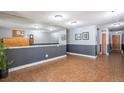 Building lobby with tile floor, mailboxes, and seating area at 801 N Pennsylvania St # 405, Denver, CO 80203