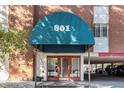 Building entrance with awning and parking underneath at 801 N Pennsylvania St # 405, Denver, CO 80203