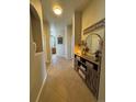 Inviting entryway with tile flooring, decorative console table, and mirror at 15455 Canyon Rim Dr # 307, Englewood, CO 80112