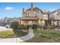 Front exterior view of a charming two-story condo unit at 4760 S Wadsworth Blvd # 108, Littleton, CO 80123