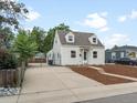 Cute bungalow with newly paved driveway and updated landscaping at 4835 Shoshone St, Denver, CO 80221