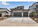 Two-story house with two-car garage and landscaped front yard at 3442 N Gold Bug Ct, Aurora, CO 80019