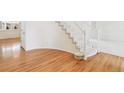 Hardwood floors and a grand staircase in the home entryway at 8154 Lone Maple Ln, Lone Tree, CO 80124