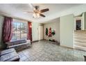 Entryway with tiled floors, coat rack and stairs at 1020 Lilac St, Broomfield, CO 80020