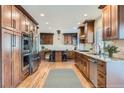 Modern kitchen with updated cabinetry and stainless steel appliances at 3624 S Ivory Ct, Aurora, CO 80013