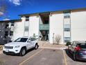 Exterior view of a building with parking at 2130 S Vaughn Way # 103E, Aurora, CO 80014