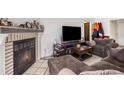 Cozy living room with a fireplace and comfortable seating at 12503 E Pacific Cir # E, Aurora, CO 80014