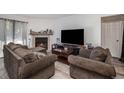 Living room featuring a fireplace and comfortable seating at 12503 E Pacific Cir # E, Aurora, CO 80014
