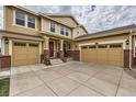 Spacious two-story home with a large driveway and brick accents at 872 Eveningsong Dr, Castle Rock, CO 80104