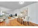 Dining area adjacent to kitchen and living room at 4110 Hale Pkwy # 1J, Denver, CO 80220