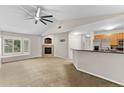 Spacious living room with fireplace and vaulted ceiling at 8653 E Dry Creek Rd # 1126, Englewood, CO 80112