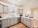 Modern kitchen with stainless steel appliances and an island at 7600 W Coal Mine Ave # B, Littleton, CO 80123