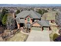 Two-story house with a gray roof, brick exterior and a two-car garage at 9839 Eliza Ct, Highlands Ranch, CO 80126