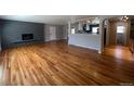 Spacious living area with hardwood floors and fireplace at 6601 E Exposition Ave, Denver, CO 80224